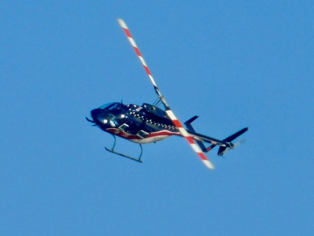 Bell JetRanger (N539AE) - Air Evac 87 making a sharp turn over Bolivar Medical Center