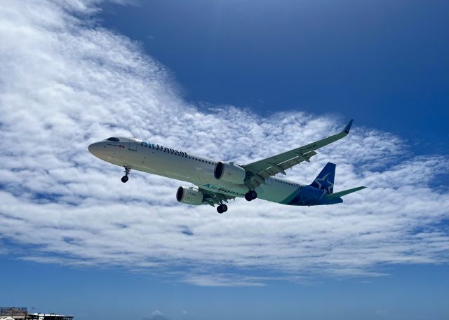 C-GOIE — - C-GOIE, a Airbus A321-271NX, coming into SXM over Maho Beach. 3/21/22. 