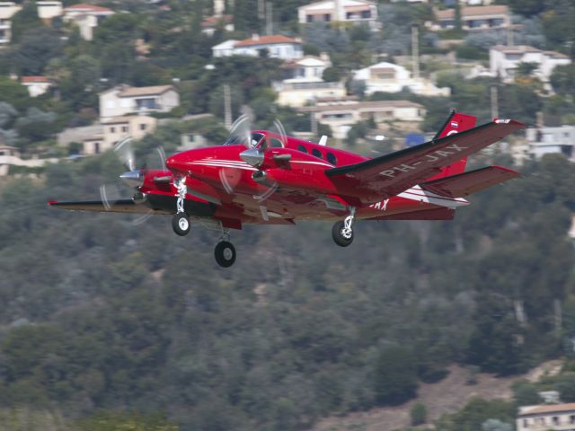 Beechcraft King Air 90 (PH-JAX) - Take off rnway 17 at Cannes, France. Nice paint job.