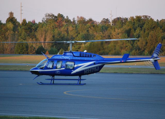— — - SUN AERO HELICOPTERS INC / Just landed beside Z-Line Desings GLF3 (N18ZL), awaiting the passengers to step off the plane and board for a short trip across I85 to the Charlotte Motor Speedway. - 10/15/10