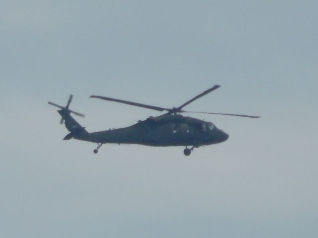 — — - A US Army UH-60 Blackhawk flies by my house in late 2020.