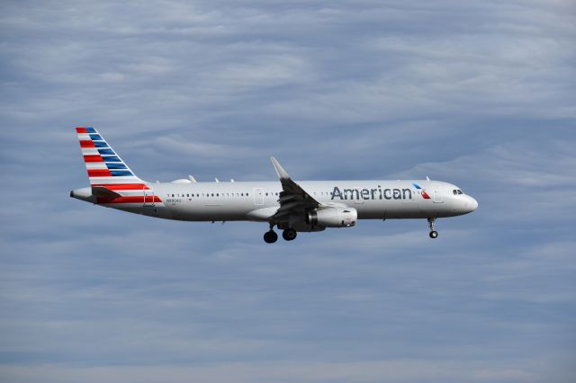 Airbus A321 (N990AU) - Taken at the Founders Plaza, while watching planes land onto runway 18R