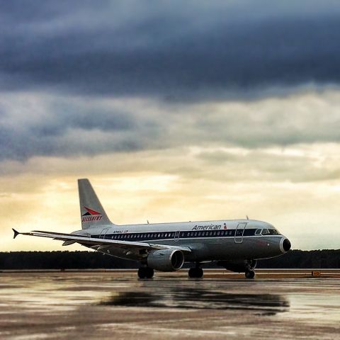 Airbus A319 (N745VJ) - Ramp view of approaching aircraft; post rain storm.