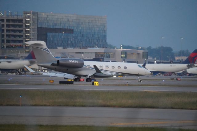 Gulfstream Aerospace Gulfstream G500 (N963U) - A G500 pulling of the runway at KMSP at dusk. 9/10/23