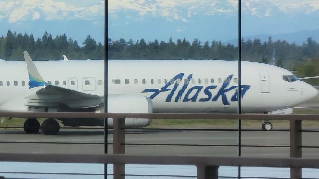 Boeing 737 MAX 9 (N926AK) - Alaska Airlines ASA451/AS451 from New Orleans (KMSY/MSY) gets distorted by the glass as it taxis to gate N15br /Photo date: 4-2-24br /Upload date 1-9-25