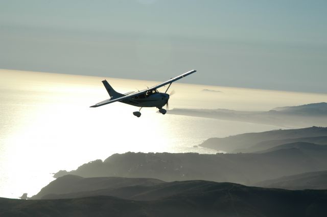 Cessna T206 Turbo Stationair (N24555) - Shot from the back of my Cherokee Six, coming around for another pass of the Golden Gate Bridge. The background is the Golden Gate National Recreation Area.
