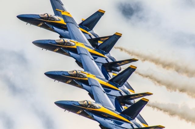 McDonnell Douglas FA-18 Hornet — - This photo was taken at the debut performance of the Blue Angels flying the F-18 Super Hornets. I thought this was a fantastic capture as the aircraft appear to be flying so close to one another that one little hiccup and they'd be bumping. I have to applaud the Blue Angels for their exceptional flying skills and trust in one another. The performance was at the 2021 Sun N Fun airshow in Lakeland Florida. Camera settings were 1/8000 shutter, F5.6, ISO 1000. The lens I used was the Canon 600mm IS. Please check out my other aviation photography. Votes and positive comments are always appreciated. Questions about this photo can be sent to Info@FlewShots.com