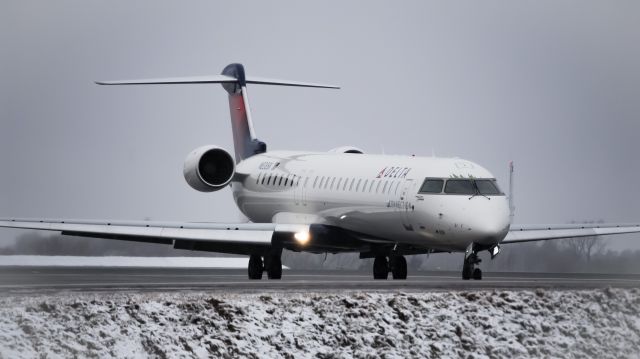 Canadair Regional Jet CRJ-900 (N838SK) - A Delta 3882, a CRJ-900 (Operated by SkyWest as SKW3882) exits the runway at Buffalo, NY (KBUF) after a short flight from Detroit, MI (KDTW)