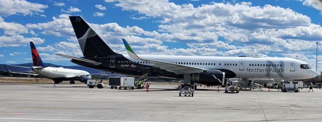 Boeing 757-200 (N628NP) - Standing just outside the fence near the tarmac on the north side of the Montrose Regional Airport terminal building.