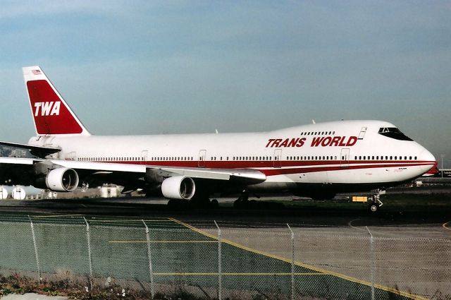 Boeing 747-200 (N305TW) - KSFO - Big Bad TWA 747 positioning onto Runway 1 R at SFO in this 1989-90 photo. Taken from the long closed Millbrae Ave air-park., I think this 747 was headed to LHR - but not sure. I'd love to see TWA flying 777-300 jets in this color scheme.