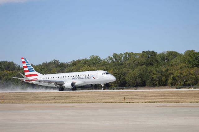 Embraer 175 (N205NN) - MHK was closed summer 2023 for runway construction (note the ample amounts of dust from the finished runway) and reopened on Sept 25 for commercial traffic. This is the moment of touch down!