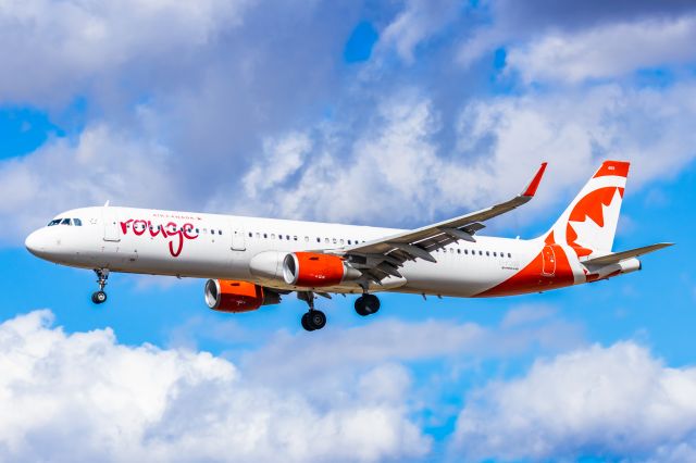 Airbus A321 (C-FJOU) - An Air Canada Rouge A321 landing at PHX on 2/26/23. Taken with a Canon R7 and Tamron 70-200 G2 lens.