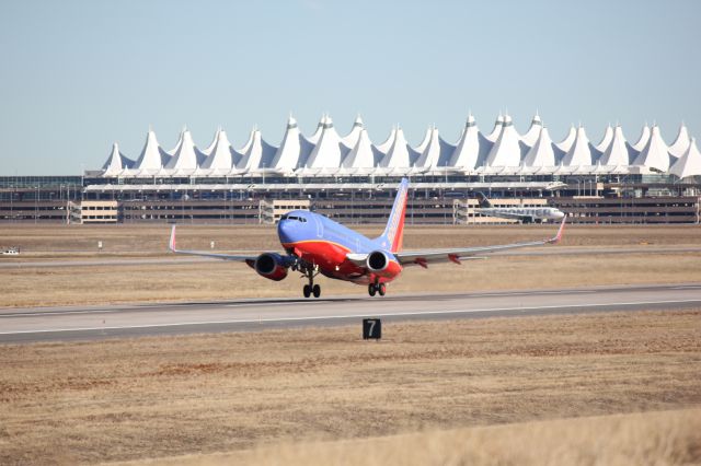 Boeing 737-700 (N232WN) - Taking off to the west at DIA.