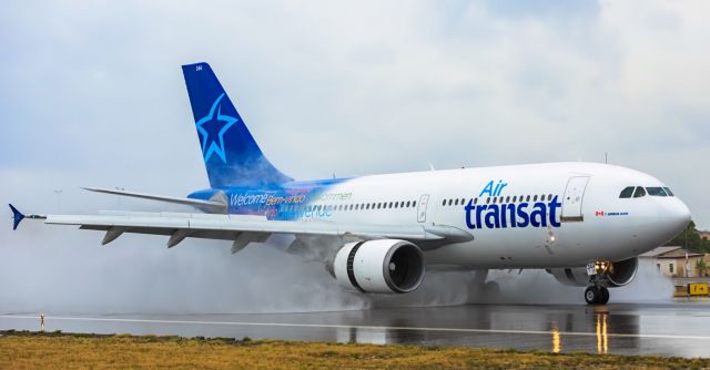 Airbus A310 (C-GTSY) - Air Transat Airbus A310 landing at TNCM on a wet runaway 15/04/2017