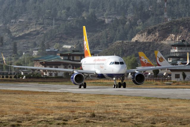 Airbus A319 (A5-JSW) - Doubling back on the active for early morning takeoff. This is Druk Airs first A319 with Sharklets. Also seen are the tail fins of Druk Airs A319 (A5-RGI) and Bhutan Airlines (new private airline of that country) A319 (A5-BAC). Because of the mountainous terrain, the runway in Paro is very short and there are no taxiways. Aircrafts often takeoff with near empty fuel tanks and refuel in nearby regional airports on flatter plains like Dhaka, Bangladesh.