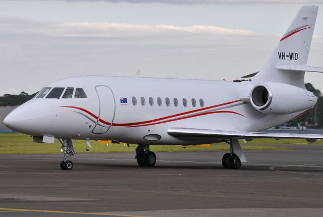 Dassault Falcon 2000 (VH-WIO) - Arriving back from Hamilton Island on a miserably dull and rainy evening, February 2, 2021.