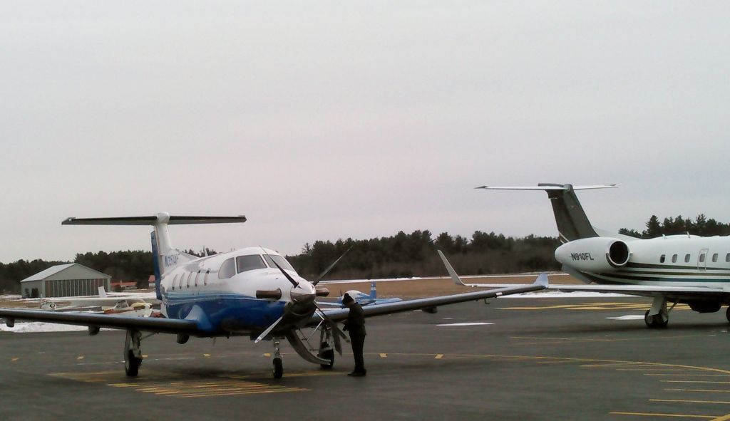 Pilatus PC-12 — - Pilatus alongside Embraer Legacy @ Orange on 1/22/16