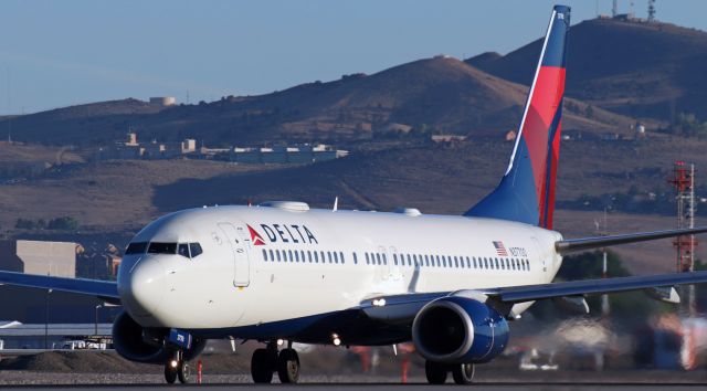 Boeing 737-800 (N37700) - Approaching Vr as it makes a sunrise hour departure from 16L enroute to Salt Lake City (KSLC).