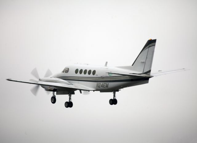 Beechcraft King Air 100 (N24EM) - Take off runway 26. The aircraft is managed by CFM Corporate Flight Management.