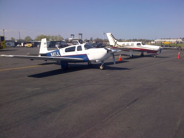 Mooney M-20 Turbo (N411JL) - The little guys on the flight line at Logan