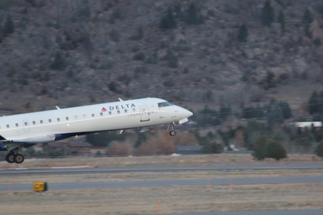 Canadair Regional Jet CRJ-700 (N713EV) - N713EV taking off at Butte as SKYWEST 4312 to KSLC.br /br /Taken 18:09, November 2, 2024 with a Canon EOS T2i and 70-300mm (300mm, 1/250, ƒ5.6, ISO 3200)