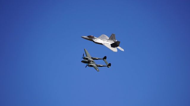 Lockheed F-22 Raptor — - F22 AND P38 (WHITE LIGHTNING) FLYING AT AN AIRSHOW