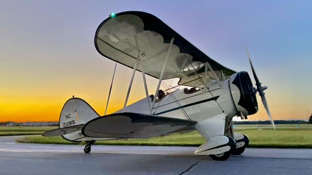 WACO OHIO YMF (N2091S) - N(C)2091S taxis back to its hangar w/ the fading sunset providing a lovely backdrop. — This aircraft is a 1931 Waco QCF, S/N 3494. 6/23/22. 