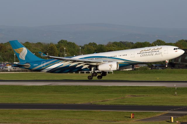 Airbus A330-300 (A4O-DJ) - An A333 instead of the usual A332 for Oman Air.  Seen from the T3 car park at Manchester