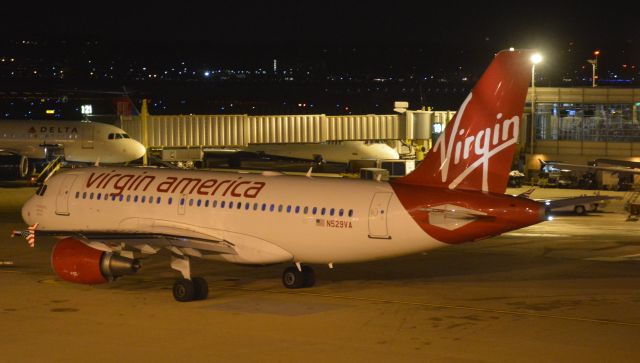 Airbus A319 (N529VA) - Pushback complete.  LED cabin mood lighting visible in windows.