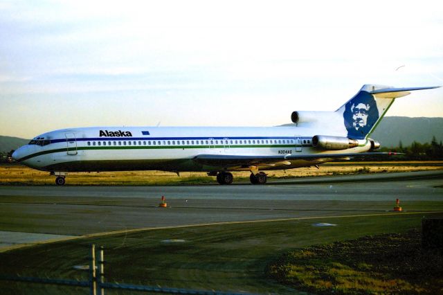 BOEING 727-200 (N304AS) - KSJC - late 1980s Alaska 727-2 arriving at San Jose from Seattle on a late afternoon shot from the temporary parking lot I used quite a bit. My 1st Alaska flight was on a 727-2 like this SJC-SEA in 1986.