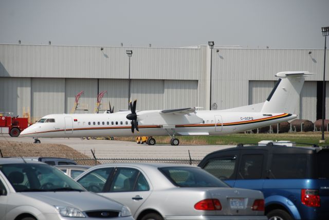 C-GCPQ — - Q400 at Downsview Airpport CYZD at Bombardier Plant. Aircraft has an Angolan flag.  April 15/10