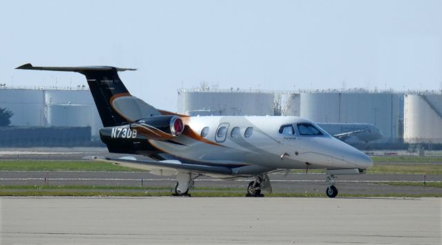 Embraer Phenom 100 (N73DB) - Catching some tarmac time is this 2009 Embraer Phenom 100 in the Autumn of 2020.