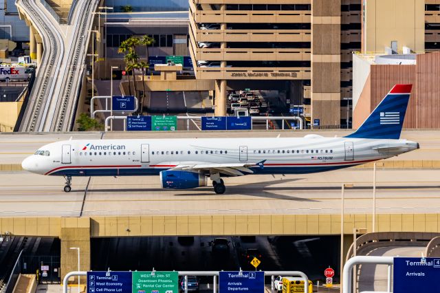 Airbus A321 (N578UW) - American Airlines A321 in US Airways retro livery taxiing at PHX on 12/16/22. Taken with a Canon R7 and Tamron 70-200 G2 lens.