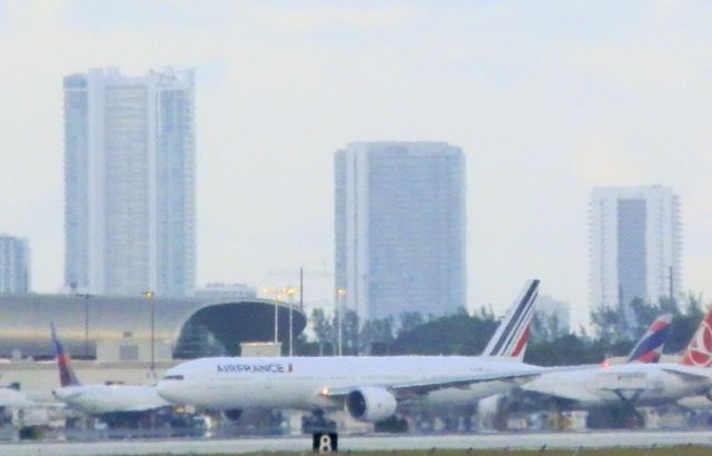 BOEING 777-300ER (F-GZNR) - Amidst a busy flightline"An AirFrance B777-300ER"Departing for Paris,Charles de Gaulle(LFPG) At dusk!"