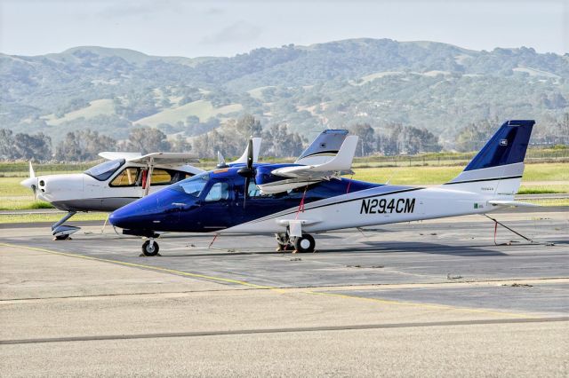 TECNAM P-2006T (N294CM) - Tecnam P2006T in front of N143TU Tecnam P2010 at Livermore Municipal Airport (CA). April 2021.