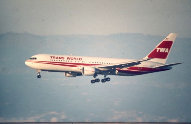 BOEING 767-200 (N604TW) - KSFO - 28L arrival for this TWA 767-2 on a late summer evening before the fog rolls in from the California coast. Boeing CN:22567 LN:30. Delv February 1983. I do not know where this jet was arriving from, time slot may be 7-8:00PM photo date apprx mid-late 1980s. Airfleets shows this as VP-CME- unsure if still flying or not. Celestron C-90 1000mm lens at SFO.hand held, slight blur.air brushed cleaned the slide before rephoto...sorry on the dust,