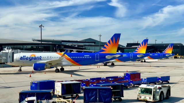 Airbus A320 (N252NV) - A line of Allegiants, all of which just flew in from various Wisconsin airports as Honor Flights