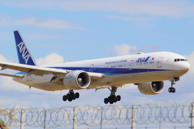 BOEING 777-300ER (JA785A) - An All Nippon Airways B777-300ER on final approach into LHR, landing on runway 27R.br /br /Location: Northern Perimiter Road, beside Runway 27Lbr /Date: 01.07.22 (dd/mm/yy).