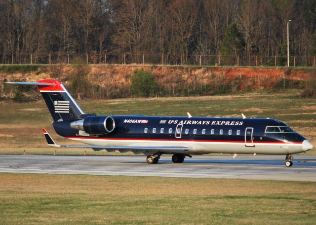 Canadair Regional Jet CRJ-200 (N406AW) - Lined up and waiting 18C - 3/18/11