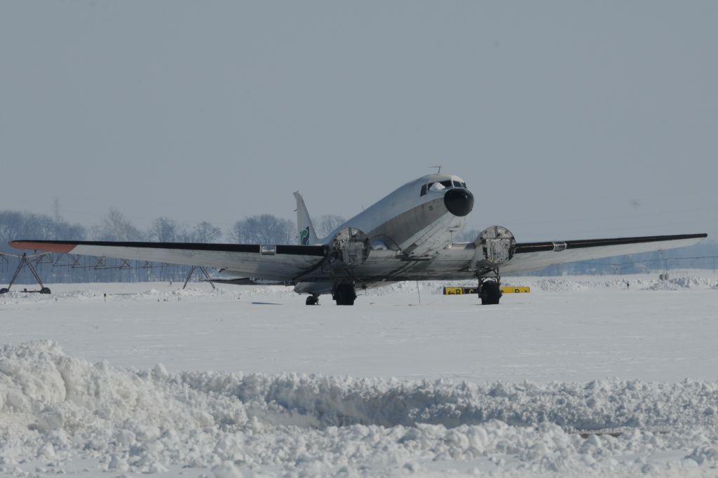 Douglas DC-3 — - Unknown DC-3 parked in a remote area of the airport. Sorry, could not get a better angle or get closer to get an "N" number. But hey, its a DC-3! Minus its engines!