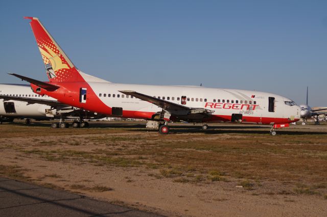 Boeing 737-700 — - Retired Regent Airlines Boeing 737-700 undergoing teardown at Goodyear AZ.  Photographed April 1th 2020.