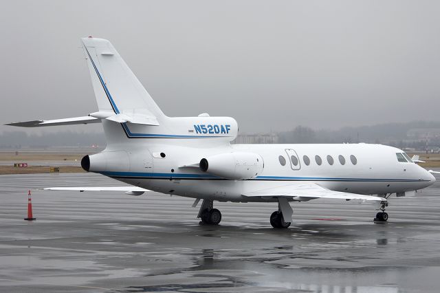 Dassault Falcon 50 (N520AF) - Enjoying the rain on the ramp. January 2014. 