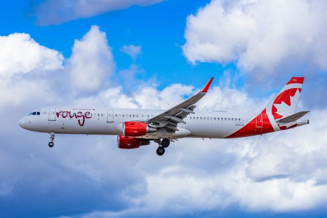 Airbus A321 (C-FJOU) - An Air Canada Rouge A321 landing at PHX on 2/26/23. Taken with a Canon R7 and Tamron 70-200 G2 lens.