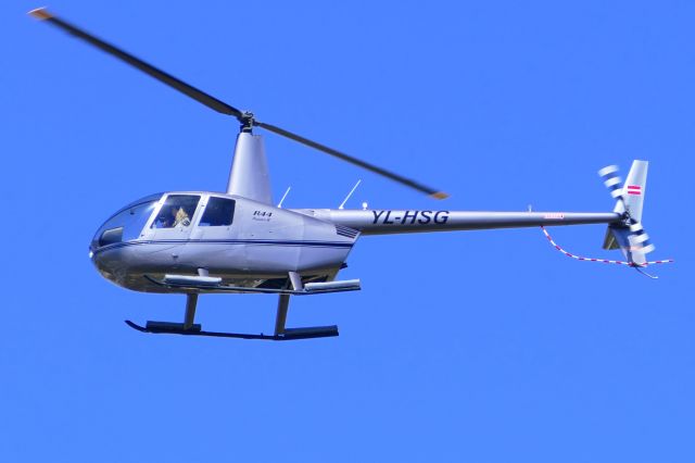 Robinson R-44 (YL-HSG) - On landing RWY23 as YLHSG