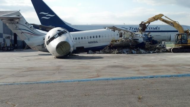 McDonnell Douglas MD-88 (UNKNOWN) - Demolishing an old MD-88 at Piedmont Triad International Airport.