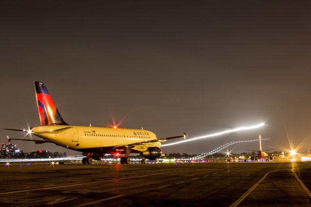 Airbus A320 — - Waiting for their gates to open while another arrival makes their way in and a Husky practices landings.