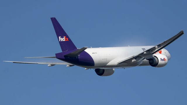 N877FD — - "Savanah" climbing away from 36L to ANC with some great vapour on the wings in the early morning! Shot using almost the entire zoom of my new lens!