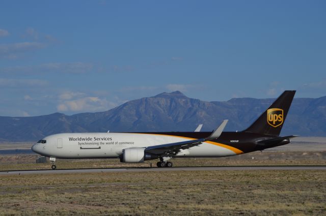 BOEING 767-300 (N361UP) - Takeoff on runway 03. Majestic Manzano Mountains in the background.