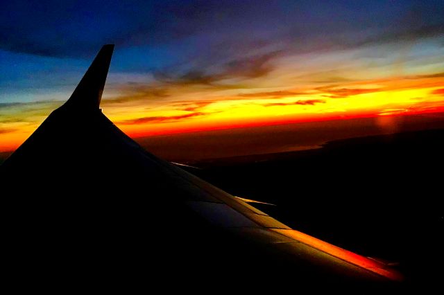 Boeing 737-700 (N230WN) - A fiery sunset above Salinas, CA. Captured onboard a Southwest flight from KSJC to KLAS in Feb 2020.