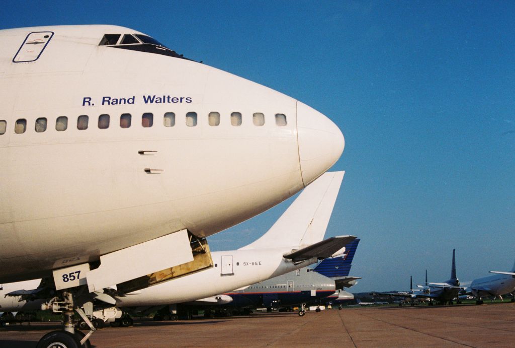 BOEING 747-100 (N857FT) - Polar Air Cargos "R. Rand Walters", N857FT, a Boeing 747-132 showing from the original Fujichrome taken circa year 2000 at Greenwood-Leflore Airport, KGWO. This was the end of the line for her and those other aircraft seen in the photo.